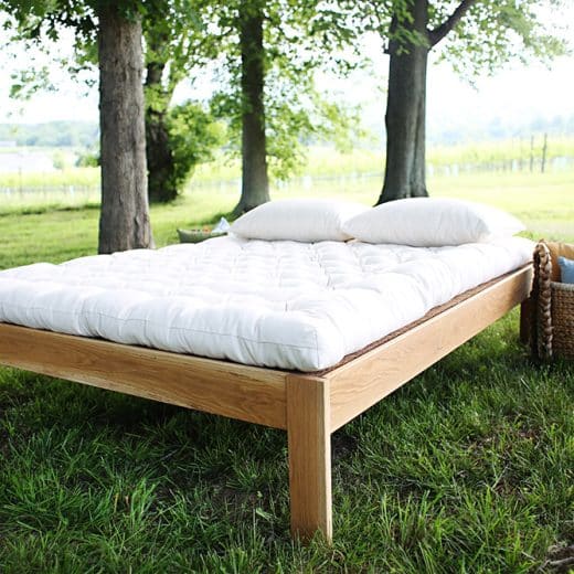 Organic wool mattress from Savvy Rest - Pastoral mattress on bed in outdoor setting