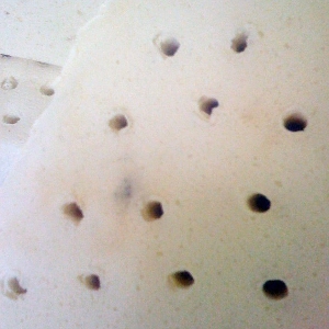 Discoloration of the latex from the baking process.