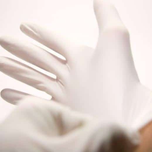 Putting on a latex glove